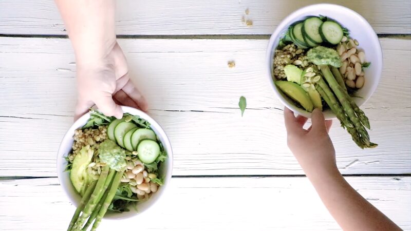 Two Green Goddess Bowls with Garlic Ginger Soy Sauce Dressing on A Table
