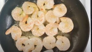 Fresh coconut shrimp, glistening in butter