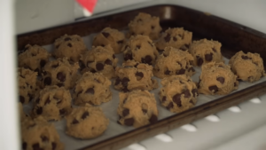 Scooped Chocolate Chip Cookie Dough Balls on A Baking Sheet Chilling in The Freezer