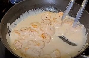 Coconut shrimp bathed in a creamy sauce, ready for a delicious meal